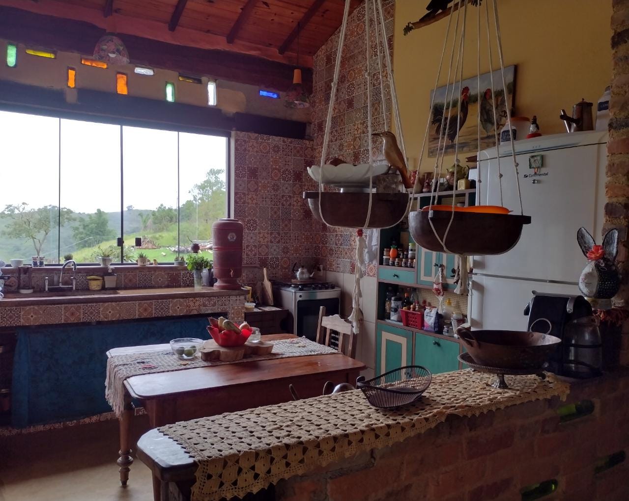 This image depicts a minimalist arrangement of ceramic teaware, including a teapot, sugar bowl, creamer, and teacup on a l...